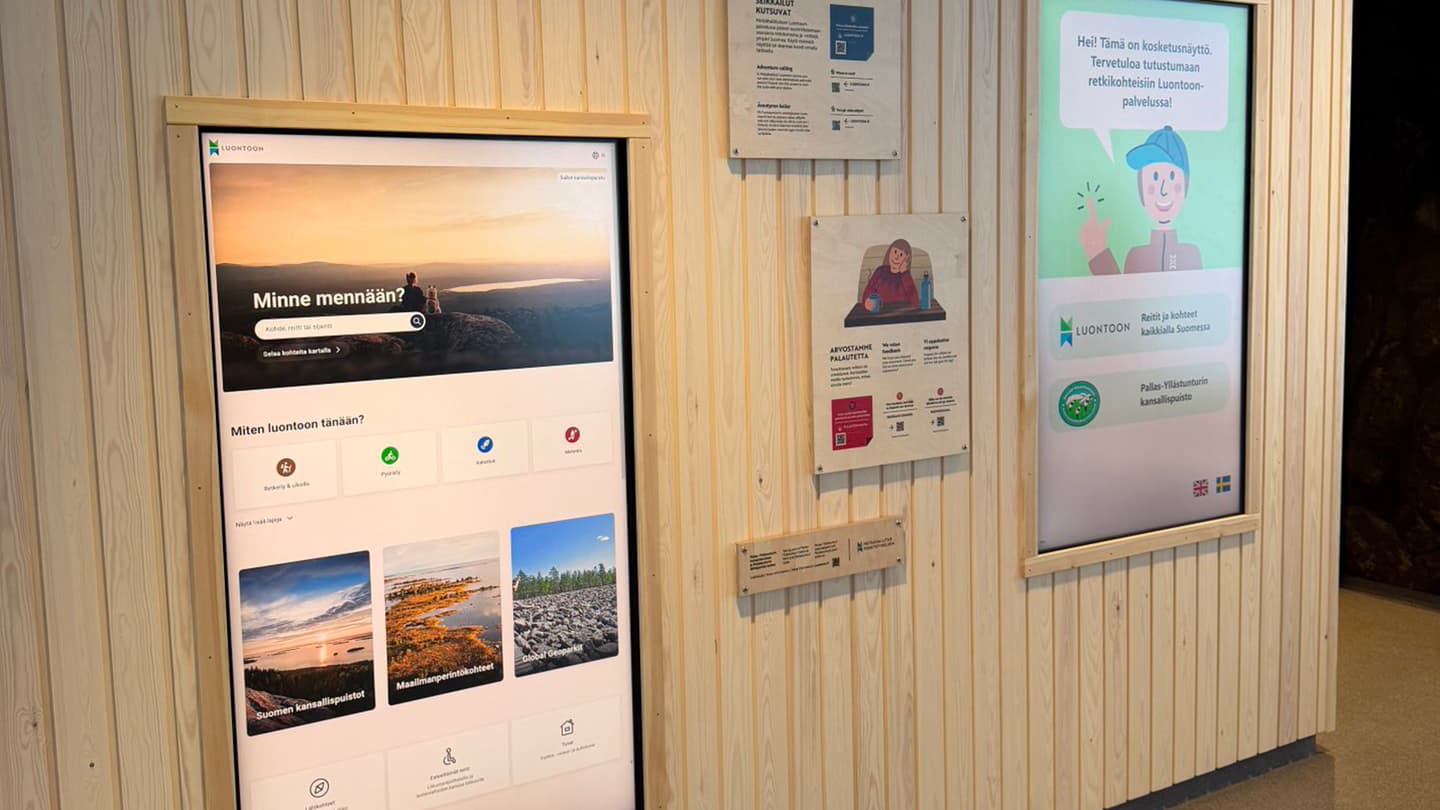 Image: Heta Kylmämaa There are two digital displays and information boards on the wall.